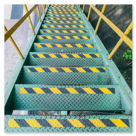 Stairwell with wallpaper neatly trimmed around balustrade