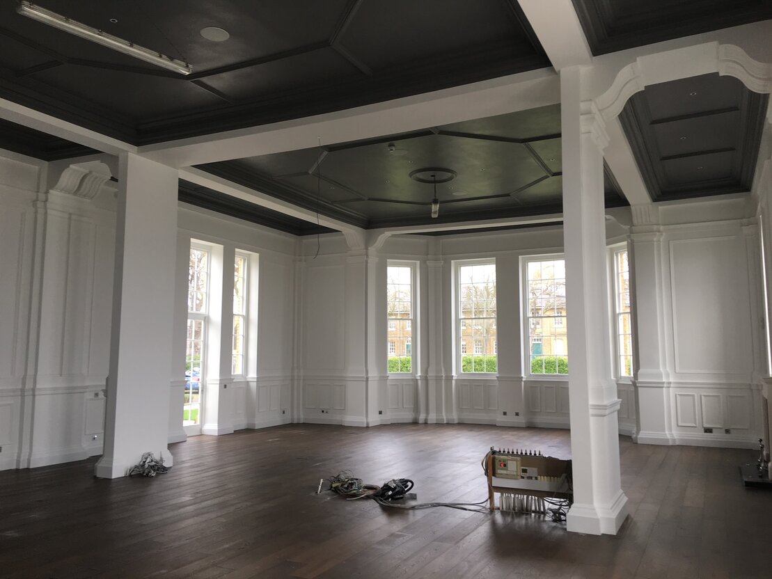 Painting interior wall with brush and roller